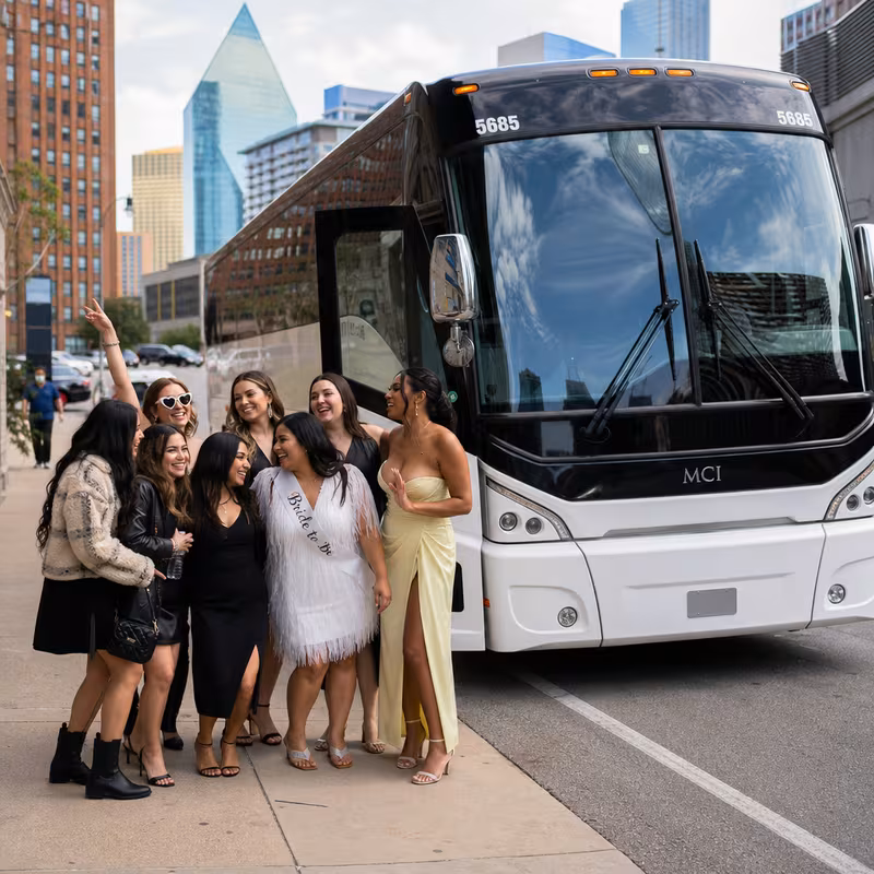 Passengers loading luggage while boarding an Dallas group shuttle