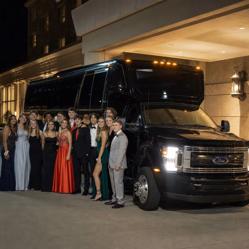 Party bus interior with wraparound leather seating and LED lighting in Dallas
