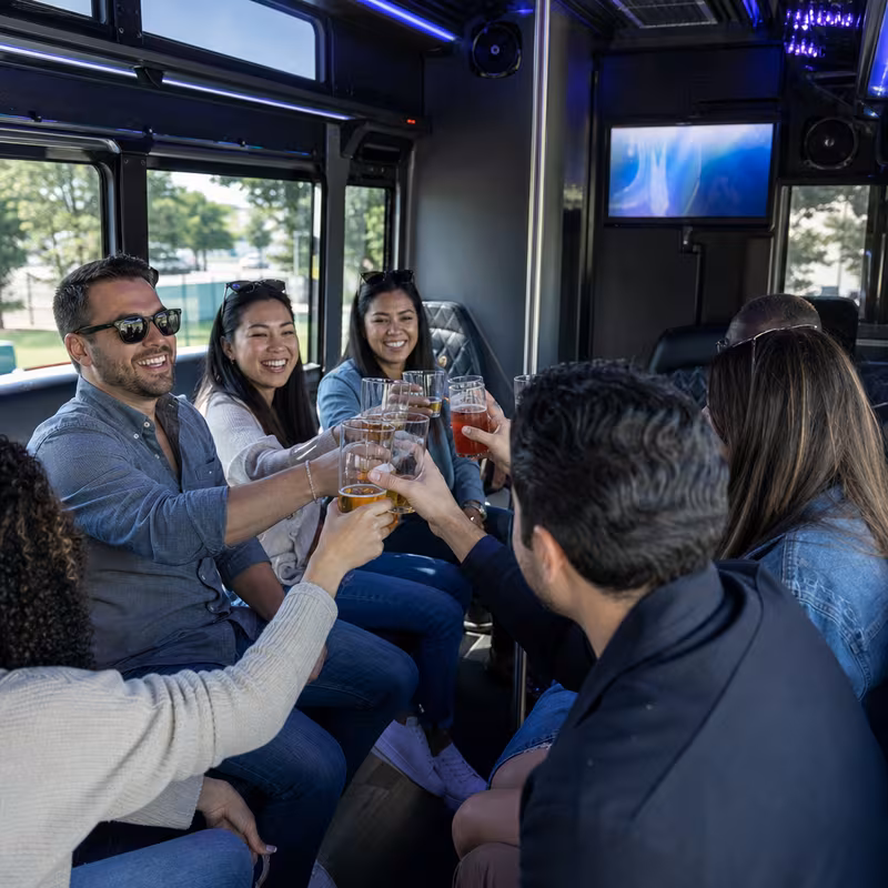 Group boarding a white charter bus for Winery & Brewery Tour Transportation transportation in Dallas