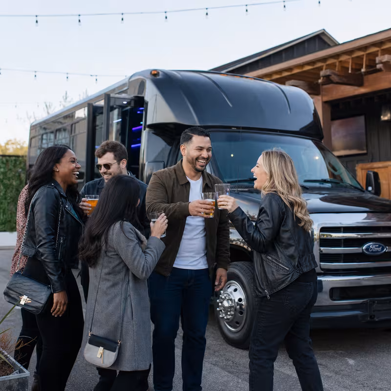 Passengers loading luggage while boarding an Dallas group shuttle